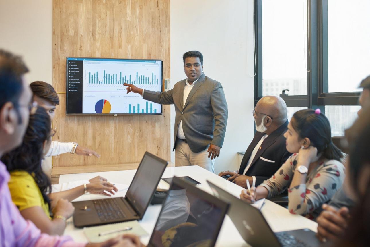 Team reviewing recruitment analytics dashboard